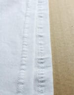 Cucitura inferiore maglietta